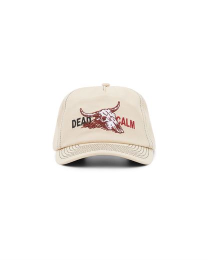 Dead Calm sand unstructured 5-panel cap with skull embroidery – angled front view
