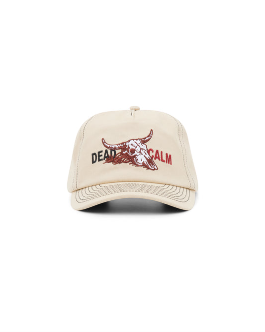 Dead Calm sand unstructured 5-panel cap with skull embroidery – angled front view